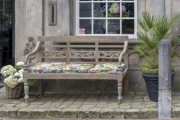 Bench with colourful cushions Bench with colourful cushions, by Zoonar Anna Reinert