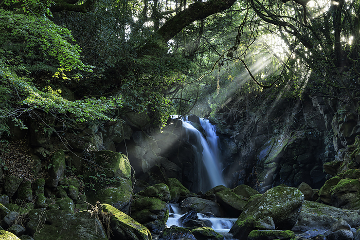 Kumamoto Prefecture A couple of waterfalls with light shining on them