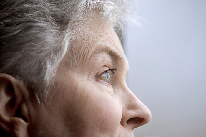 JOSAR_ruble_crystal Close up profile of a senior woman s face as she watches for birds at a bird sanctuary  Gibbon, Nebraska, United States of America, by Joel Sartore Photography   Design Pics
