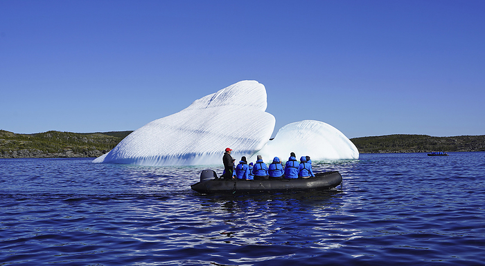NA Tourists observing iceberg from inflatable boat, by Bill Banaszewski   Design Pics