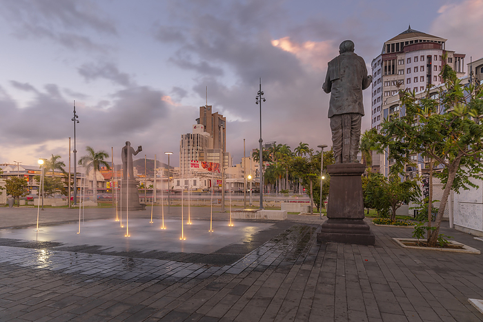 View of statue in Caudan Waterfront in Port Louis at dusk, Port Louis, Mauritius, Indian Ocean, Africa View of statue in Caudan Waterfront in Port Louis at dusk, Port Louis, Mauritius, Indian Ocean, Africa, by Frank Fell