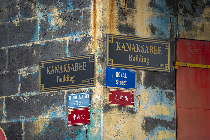 View of signs on wall in Chinatown, Port Louis, Mauritius, Indian Ocean, Africa View of building and street signs on wall in Chinatown, Port Louis, Mauritius, Indian Ocean, Africa, by Frank Fell