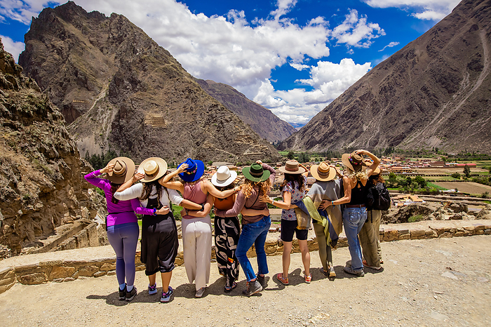 Women looking out over Ollantaytambo Women looking out over Ollantaytambo, Peru, South America, by Laura Grier