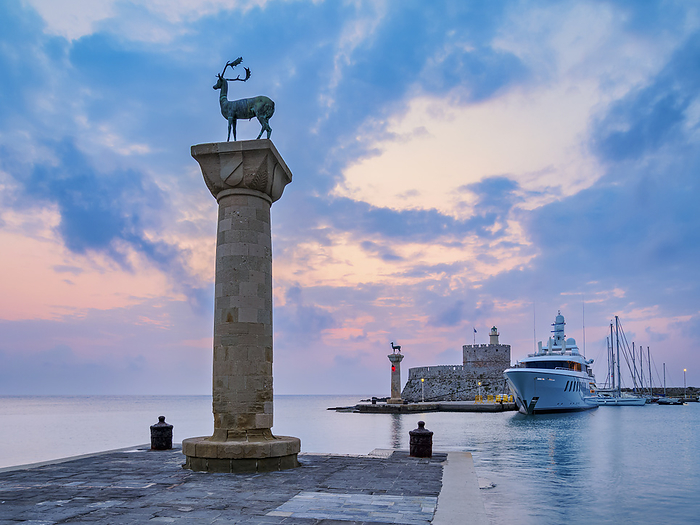 Dear and Doe on the columns at the entrance to the Mandraki Harbour, former Colossus of Rhodes location, Saint Nicholas Fortress in the background, sunrise, Rhodes City, Rhodes Island, Dodecanese, Greece Deer and Doe on columns at the entrance to Mandraki Harbour, former Colossus of Rhodes location, Saint Nicholas Fortress in the background, sunrise, Rhodes City, Rhodes Island, Dodecanese, Greek Islands, Greece, Europe, by Karol Kozlowski