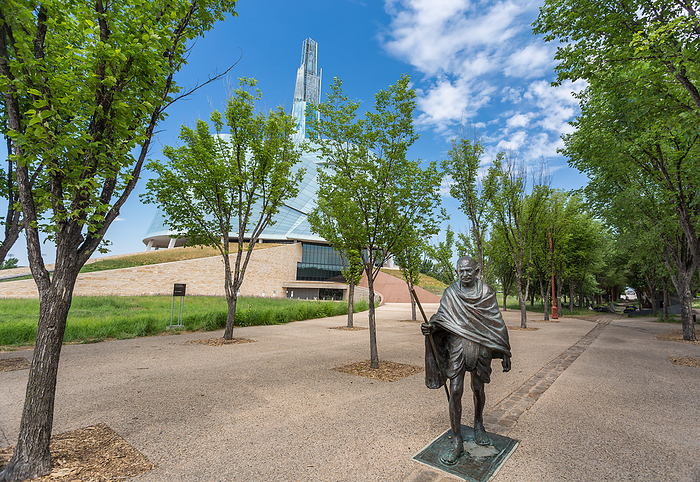 The statue of Mahatma Gandhi at the entrance to the Canadian Museum for Human Rights in Winnipeg, Manitoba, Canada. Cast in bronze and weighing 500kg, it was unveiled in 2010. The bronze statue of Mahatma Gandhi, weighing 500 kg, unveiled in 2010, at the entrance to the Canadian Museum for Human Rights in Winnipeg, Manitoba, Canada, North America, by Barry Davis