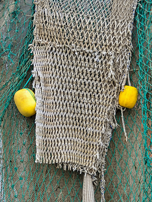 Fishing net with yellow floats as maritime background Fishing net with yellow floats as maritime background, by Zoonar Katrin May