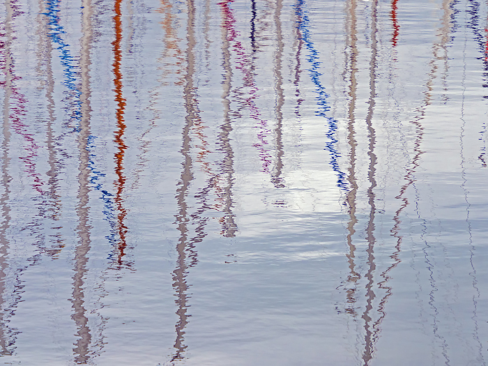 Abstract reflection of colored masts of sailboats in the water of a harbor Abstract reflection of colored masts of sailboats in the water of a harbor, by Zoonar Katrin May