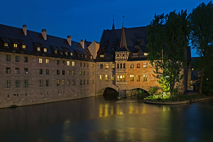 Historic Holy Ghost Hospital on the Pegnitz River in the Old Town of Nuremberg at Blue Hour, Germany Historic Holy Ghost Hospital on the Pegnitz River in the Old Town of Nuremberg at Blue Hour, Germany, by Zoonar Katrin May