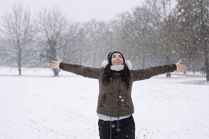 Woman under a snowfall. Woman under a snowfall, Milan, Italy
