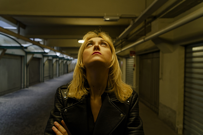Young blond woman indoors. Young blond woman indoors., Milano, Italy.