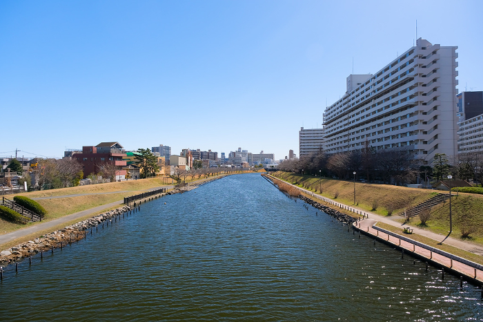 Tokyo Old Nakagawa River seen from Fureai Bridge and residential areas in Edogawa and Koto wards