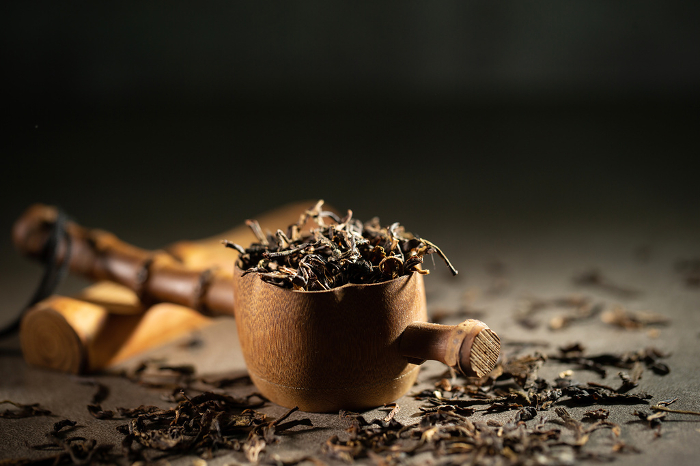 tea utensils and dried leaf tea