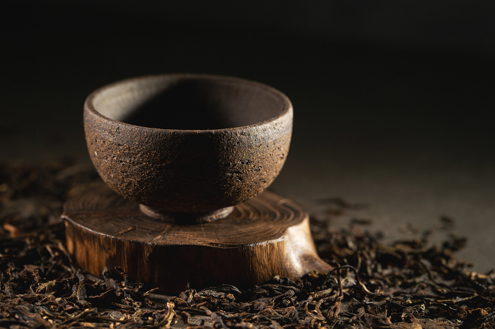 Dried leaf tea and tea bowl