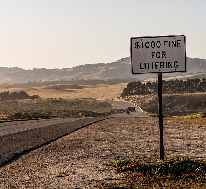 Fine for littering Sign at Coast Highway Fine for littering Sign at Coast Highway, by Zoonar Christoph Sch