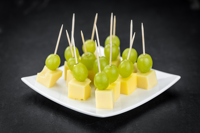 Cheese blocks with grapes  partyfood  Cheese blocks with grapes  partyfood , by Zoonar Christoph Sch