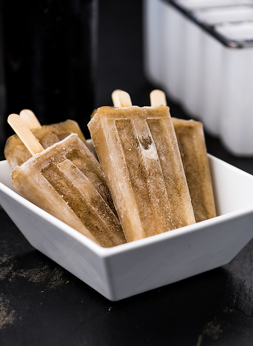 Some homemade Cola Popsicles Some homemade Cola Popsicles, by Zoonar Christoph Sch
