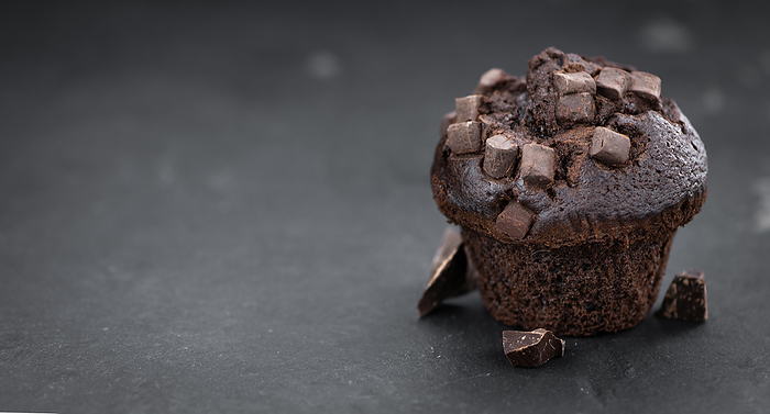 Fresh made Chocolate Muffins on a slate slab  close up shot  selective focus  Fresh made Chocolate Muffins on a slate slab  close up shot  selective focus , by Zoonar Christoph Sch