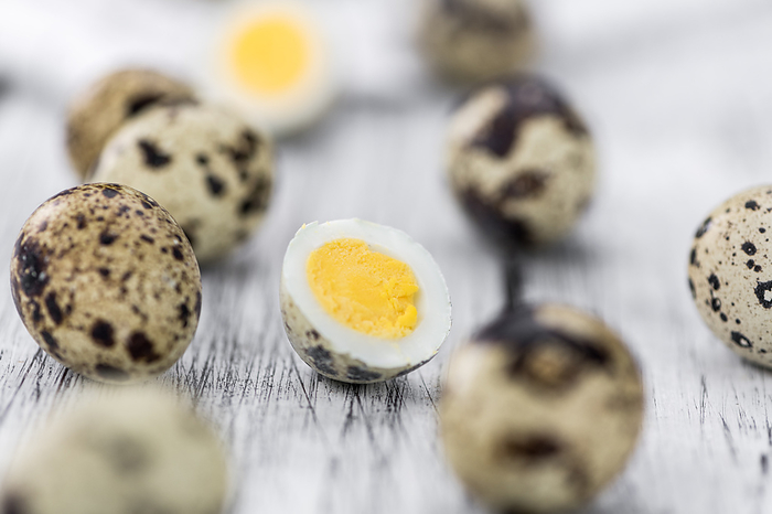 Some fresh Quail Eggs on wooden background  selective focus  close up shot  Some fresh Quail Eggs on wooden background  selective focus  close up shot , by Zoonar Christoph Sch