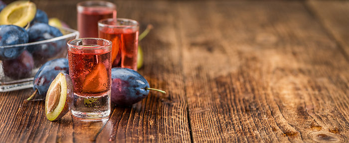 Fresh made Plum Liqueur on a rustic background Fresh made Plum Liqueur on a rustic background, by Zoonar Christoph Sch