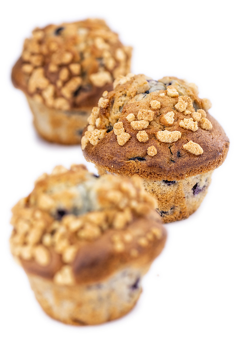 Some Blueberry Muffins isolated on white  selective focus  Some Blueberry Muffins isolated on white  selective focus , by Zoonar Christoph Sch