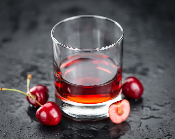 Portion of Cherry Liqueur on a slate slab Portion of Cherry Liqueur on a slate slab, by Zoonar Christoph Sch