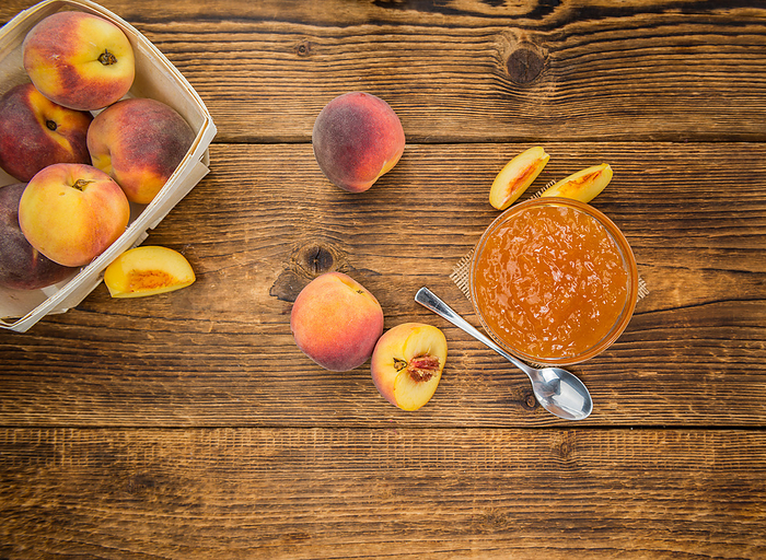 Peach Jam on wooden background  selective focus Peach Jam on wooden background  selective focus, by Zoonar Christoph Sch