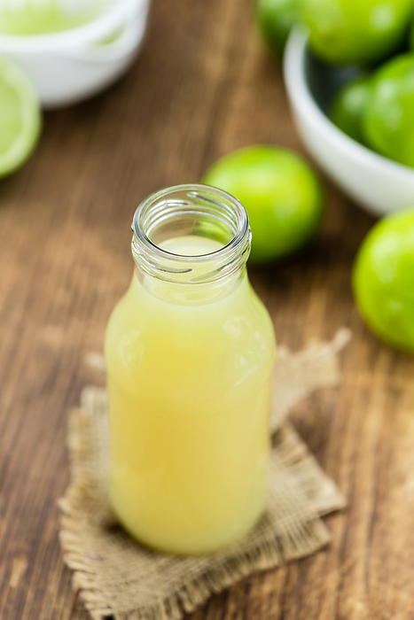 Fresh Lime Juice on wooden background  selective focus  Fresh Lime Juice on wooden background  selective focus , by Zoonar Christoph Sch