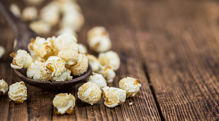 Popcorn on wooden background  selective focus Popcorn on wooden background  selective focus, by Zoonar Christoph Sch