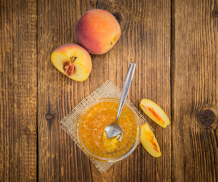 Fresh made Peach Jam on a rustic background Fresh made Peach Jam on a rustic background, by Zoonar Christoph Sch