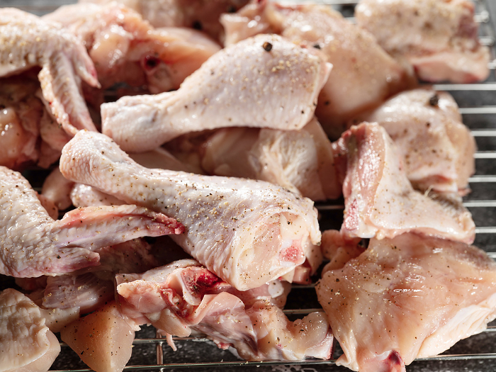 Bone-in cuts of raw chicken