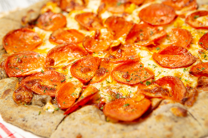 Pepperoni pizza on cutting board