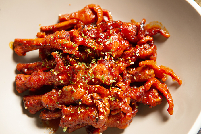 Korean stir-fried chicken feet with hot sauce, tappal