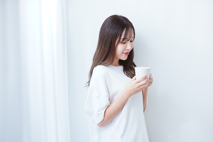 Japanese woman drinking a hot drink
