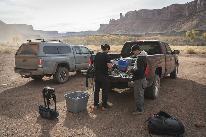 Male mountaineers with equipment in pick up truck preparing for rock climbing Climbers with equipment in pick up truck preparing for rock climbing, by Cavan Images   Brandon Huttenlocher