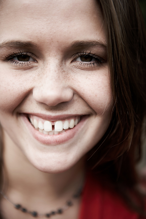 A close up of a woman smiling, by Cavan Images / dund photography