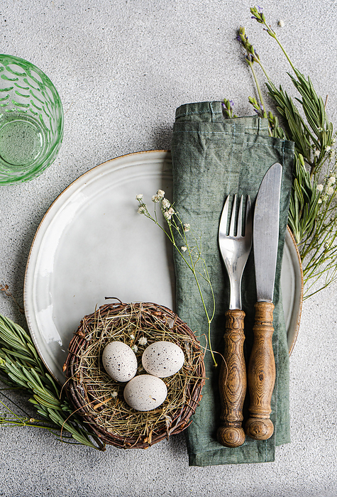 Easter table setting with nest, by Cavan Images / Anna Bogush