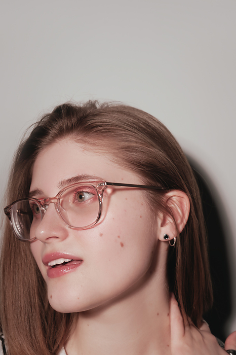 Photo of pretty charming young woman wearing glasses Photo of pretty charming young woman wearing glasses, by Cavan Images   Darya Kisialiova