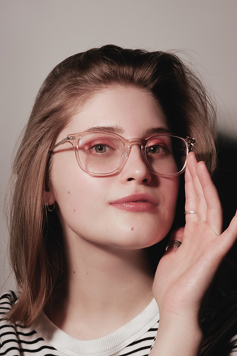 Photo of pretty charming young woman wearing glasses Photo of pretty charming young woman wearing glasses, by Cavan Images   Darya Kisialiova