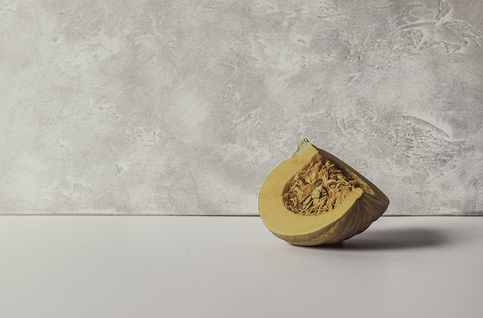 Pumpkin Slice on a White Background, by Cavan Images / Sara Ghedina