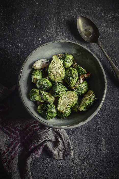 Roasted Brussel Sprouts in a Bowl, by Cavan Images / Sara Ghedina