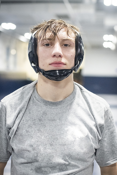 15 year old female  wrestler Highschool portrait of male wrestler during practice, by Cavan Images   Sue Barr Photo