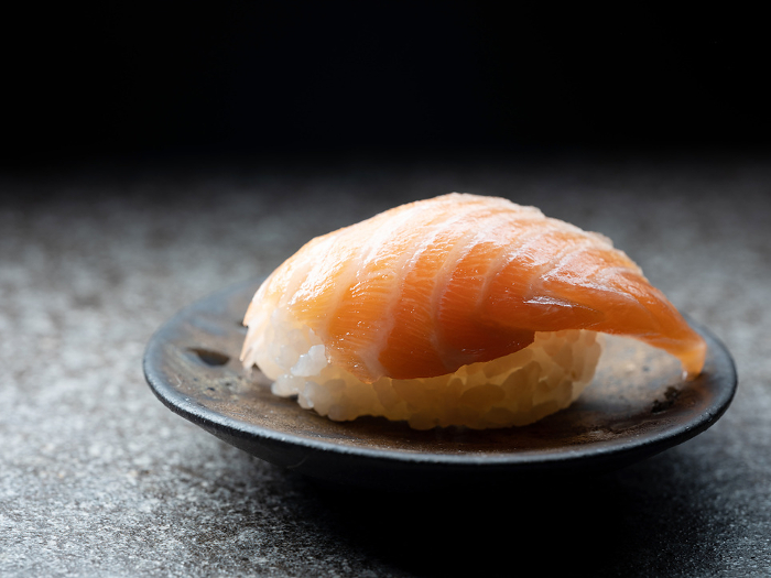 Sliced salmon sushi on a plate