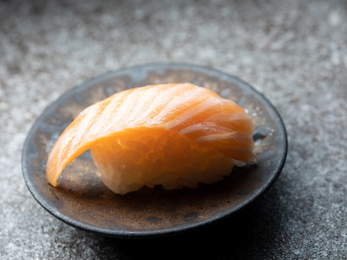 Sliced salmon sushi on a plate