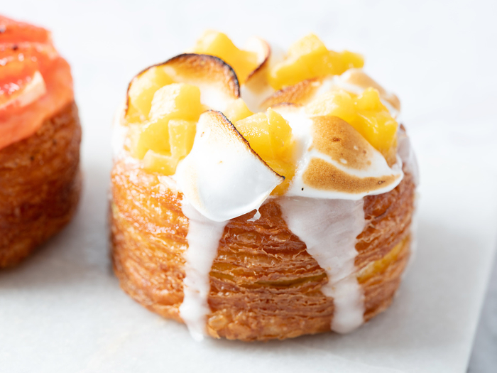 Peach croissant donuts on marble background