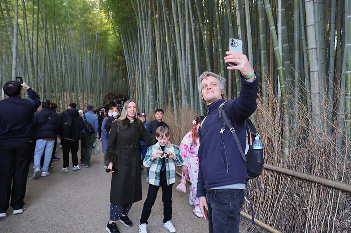 Crowded with tourists in Kyoto Foreign tourists take picture of Bamboo Forest in Arashiyama, Kyoto Prefecture, Japan, March 22, 2024.  Photo by Yohei Osada AFLO 