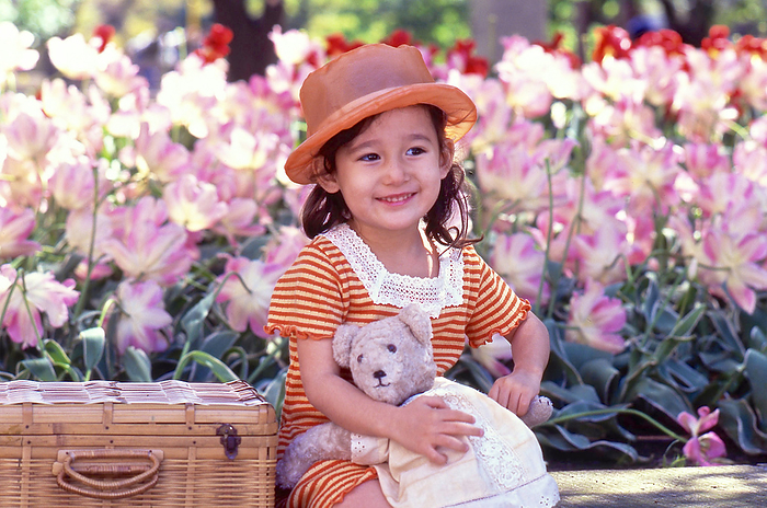 Girl holding a teddy bear