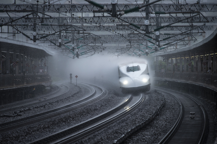 Shinkansen N700A running with rain splashes