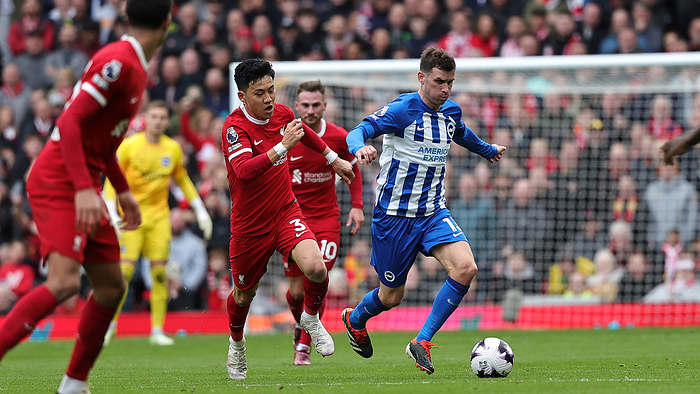 Liverpool v Brighton and Hove Albion Premier League 31 03 2024. Wataru Endo Liverpool s Wataru Endo in action during the Premier League match between Liverpool and Brighton and Hove Albion at Anfield, Liverpool, England on 31 March 2024.