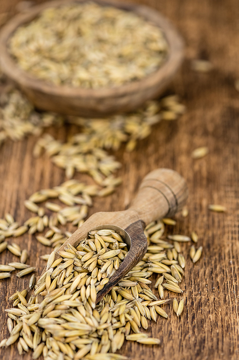 Vintage wooden table with Oat  selective focus  close up shot  Vintage wooden table with Oat  selective focus  close up shot , by Zoonar Christoph Sch