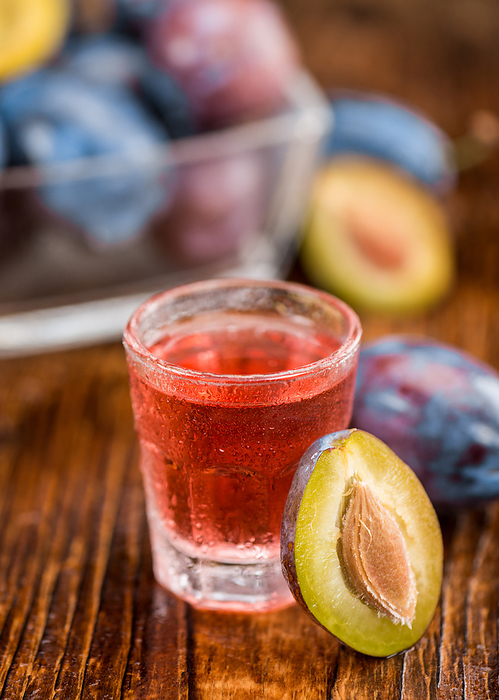 Fresh made Plum Liqueur on a rustic background Fresh made Plum Liqueur on a rustic background, by Zoonar Christoph Sch